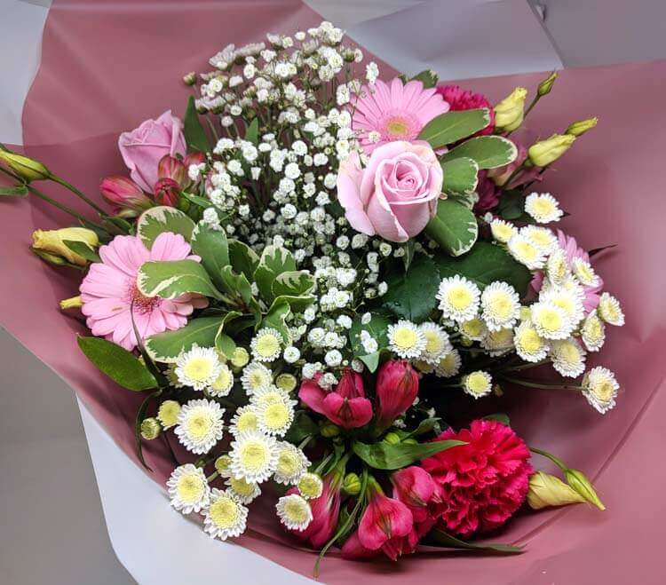 baby girl hand tied flowers